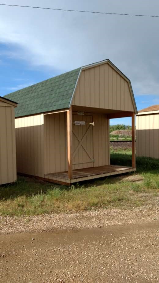 Loft Style Wood Storage Sheds With a 4 ft. Deck on Front 