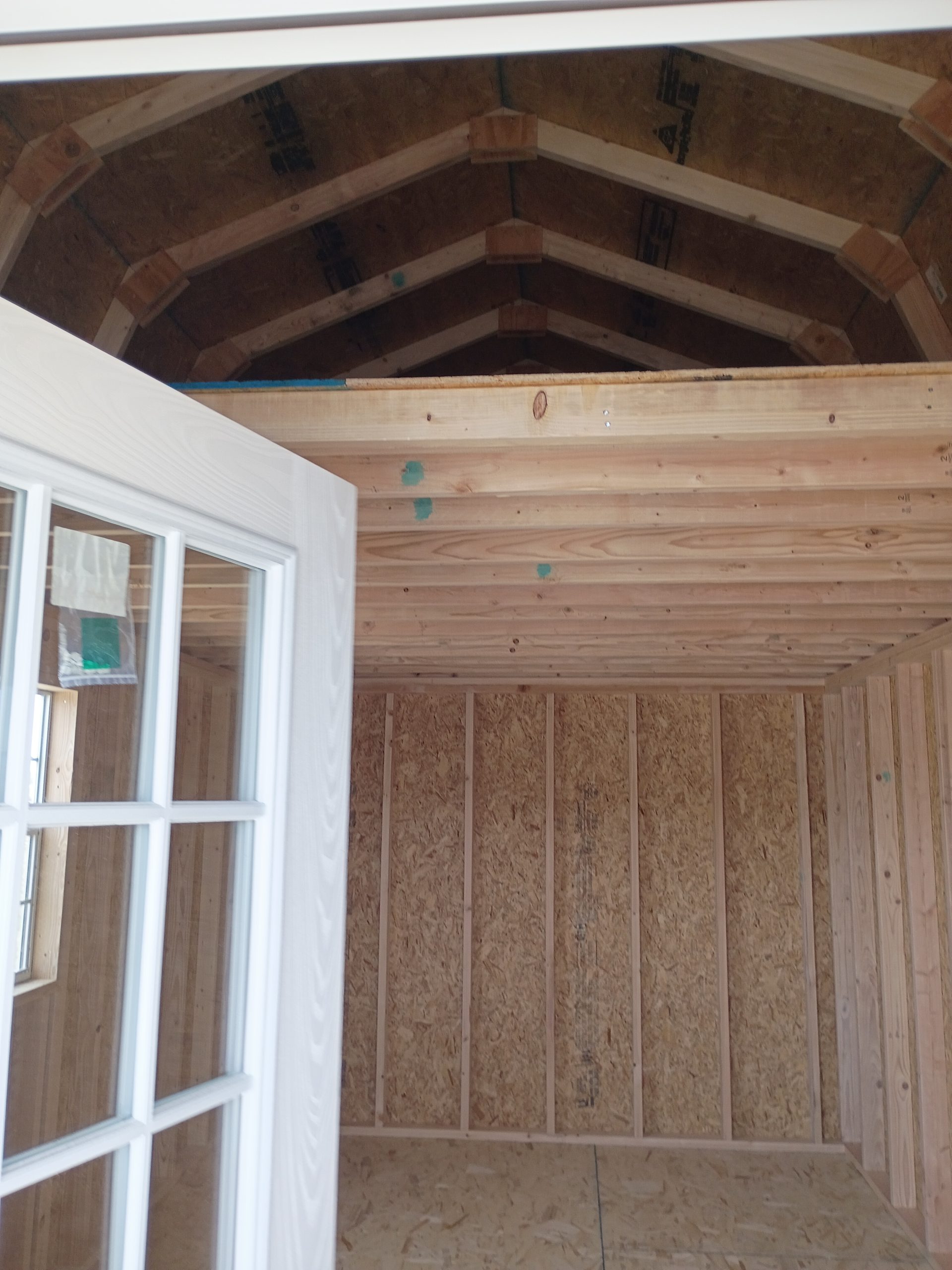 Steel Clad Man Door in a Loft Style Wood Shed